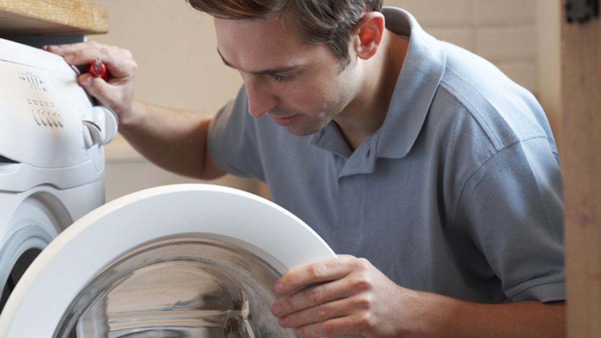 Engineer Mending Domestic Washing Machine